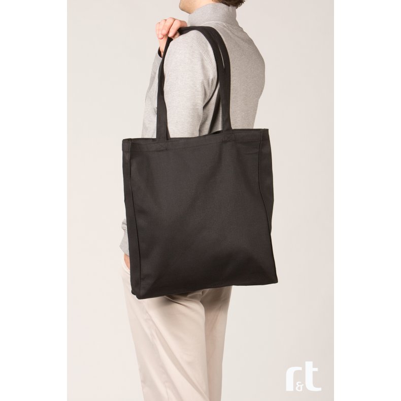 Mulepose med lang hank, side og bund fals. 